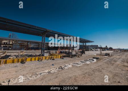 Train station of Grosuplje in Slovenia is being renovated. Visible new train platforms and future track bed. on a sunny day. Stock Photo