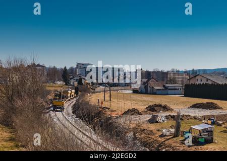 Train station of Grosuplje in Slovenia is being renovated. Visible work train parked on a siding on a sunny day. Stock Photo