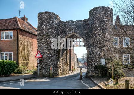 The Grade I listed 13th century Bailey Gate - one of only two entrances to the medieval town of Castle Acre, Norfolk. Stock Photo