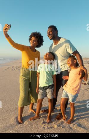 Happy Family With Blue Sky Stock Photo - Alamy