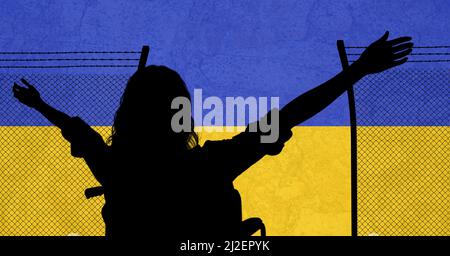 Silhouette of woman with arms wide open and barbed wire fence against ukraine background Stock Photo