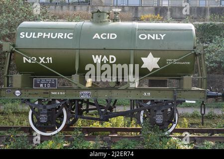 vintage railway freight wagon and sulphuric acid tanker on rail line at ...