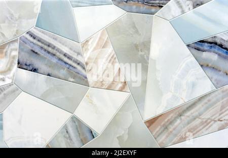 Ceramic tiles made of multi-colored pieces with textures of natural stones. Stock Photo