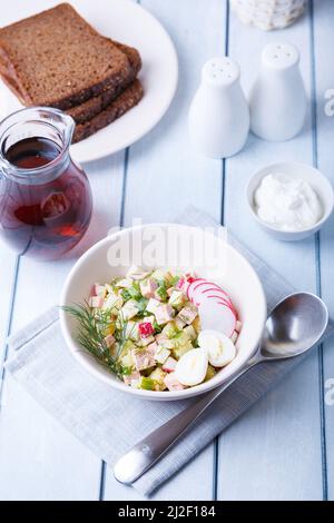 Okroshka with kvass and sausage. Traditional classic cold Russian soup. Close-up. Stock Photo