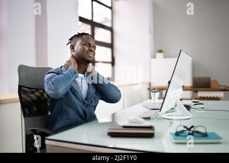Bad Posture Neck Pain At Office Computer Stock Photo