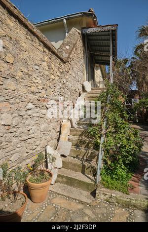 The stone exterior steps, staircase that lead up to the women's section. Old, broken tablets have been placed along the steps. At the La Signora synag Stock Photo