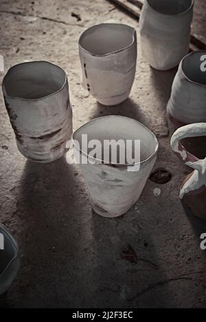 handmade ceramics, empty craft ceramic cup on gray background Stock Photo