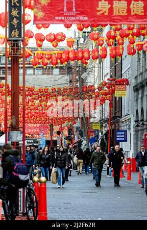 Crowds and tourists in a colourful China town in Gerrard Street central London England UK Stock Photo
