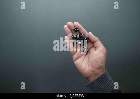 Black Dice trowing on black background top view  Stock Photo