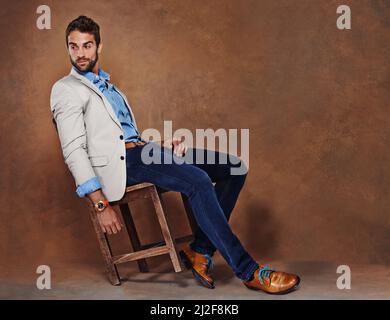 Laid-back style. Studio shot of a stylishly dressed young man. Stock Photo