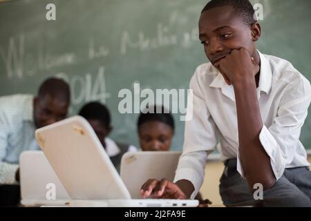 Students study using new laptop computers at Olukolo Junior Secondary School in Ondangwa, Namibia.   As part of the MCC-funded renovation and expansio Stock Photo
