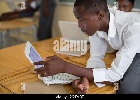 Students study using new laptop computers at Olukolo Junior Secondary School in Ondangwa, Namibia.   As part of the MCC-funded renovation and expansio Stock Photo