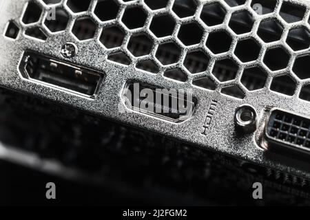 New shiny PC ventilation grille and digital video sockets, abstract close-up photo with selective focus Stock Photo
