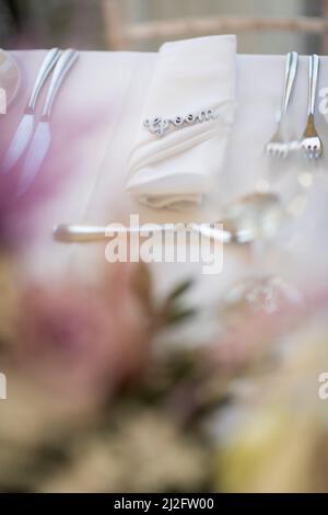 Flower table decorations for holidays and wedding dinner. Table set for holiday, event, party or wedding reception in a restaurant. Stock Photo