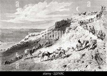 Caravan of pilgrims on camels on their way to Nedjed, Saudi Arabia. Pilgrimage to Nedjed, cradle of the Arab race by Lady Anna Blunt 1878-1879, Le Tour du Monde 1882 Stock Photo