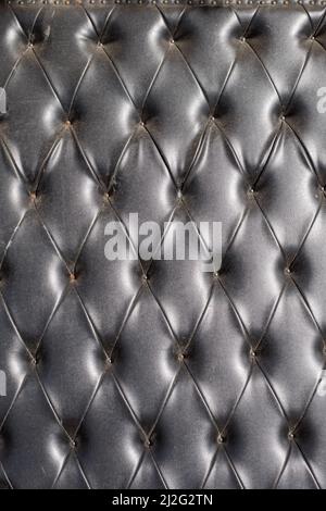 old leather sofa cushion with rivets texture Stock Photo