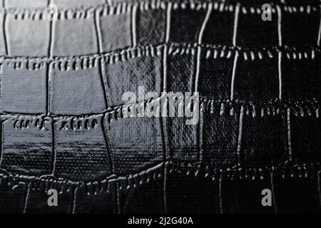 Texture of black crocodile skin in the background in full screen Stock Photo