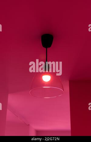 Luminary on the ceiling in the room in the red light Stock Photo