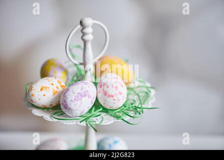 Painted eggs in a plate for the holiday of easter Stock Photo