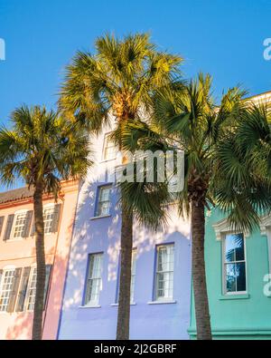 Historic Rainbow Row colorful house and palm trees seen in Charleston South Carolina Stock Photo