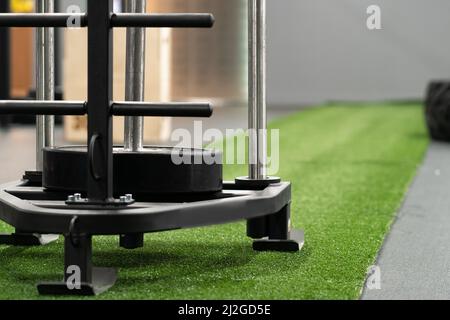 Sled fit young cross training, in the afternoon push muscular from athlete and fitness bodybuilder, prowler health. Physical workout weight, effort Stock Photo