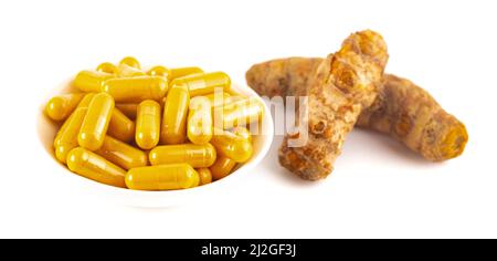 Turmeric in Capsule form Isolated on a White Background Stock Photo