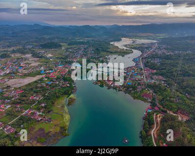 Lake Poso (Indonesian: Danau Poso) is a lake in Central Sulawesi, Indonesia, and the third-deepest lake in Indonesia.  The town of Pendolo is situated Stock Photo