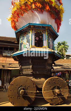 Gokarna, India - February 19, 2016: Ancient wooden chariot with flags and paintings of hindu Gods, Karnataka state Stock Photo