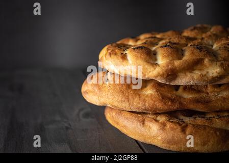 Ramadan Pita (Ramazan Pidesi). Traditional Turkish bread for holy month Ramadan. Side view and copy space. Stock Photo