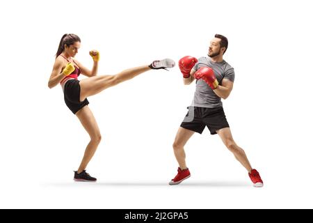 Young man and woman exercising kick box isolated on white background Stock Photo