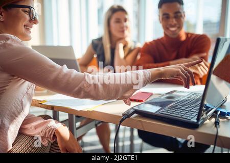 Group of colleagues chatiing on a break in the office Stock Photo