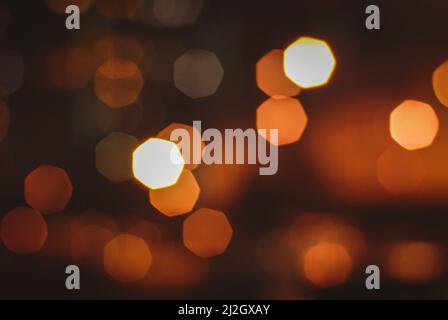 Blurry street lights at night, abstract background of bokeh warm light Stock Photo
