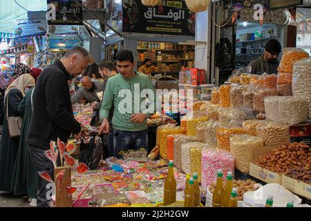 Gaza City. 31st Mar, 2022. A man shops at Al-Zawiya market ahead of Ramadan in Gaza City, on March 31, 2022. TO GO WITH 'Feature: Palestinians prepare for Ramadan amid increasing prices of goods' Credit: Rizek Abdeljawad/Xinhua/Alamy Live News Stock Photo