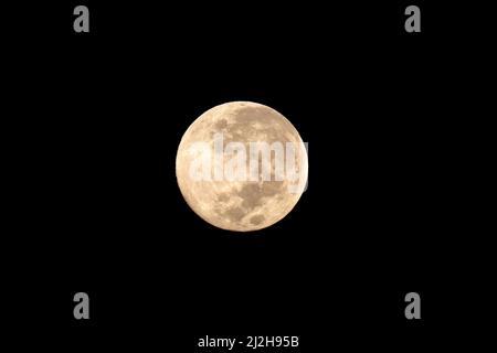 View of a full moon in a cloudless, clear sky Stock Photo