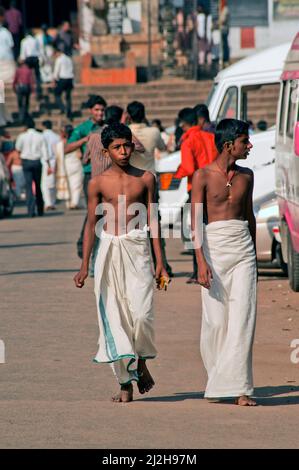 Two young devotee in front of Anantha Padmanabhaswamy Temple at Trivandrum or Thiruvananthapuram state Kerala India Stock Photo