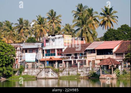 Residential houses near pond of Anantha Padmanabha swamy Temple at Trivandrum or Thiruvananthapuram state Kerala India Stock Photo