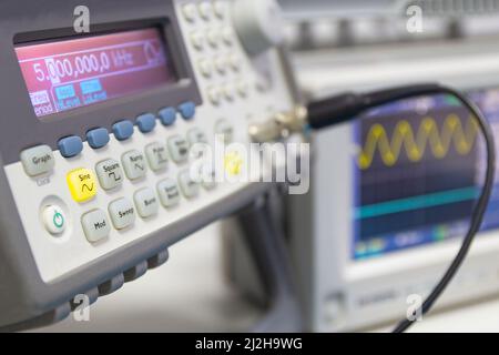 Power supplies and electronic measuring devices in the laboratory.Electronic measuring instruments in science lab. Stock Photo