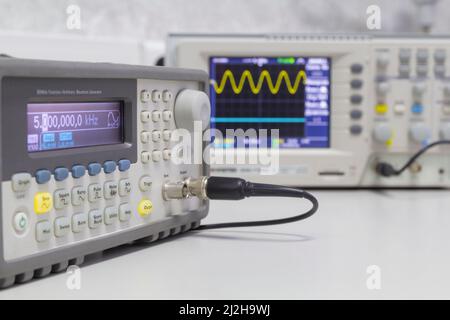 Power supplies and electronic measuring devices in the laboratory.Electronic measuring instruments in science lab. Stock Photo