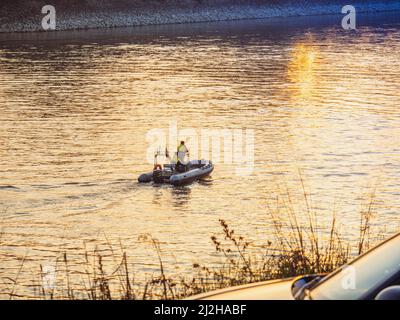 IRS tax evasion police guardia di finanza at sunset in the coast of river Po, Lombardy, Italy Stock Photo