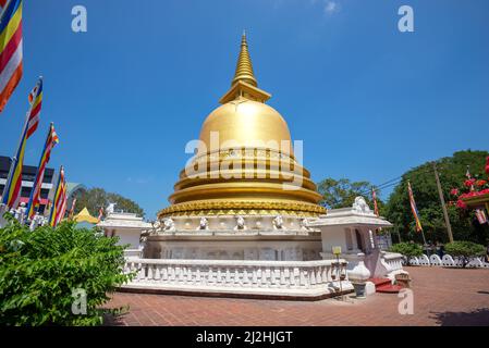 DAMBULLA, SRI LANKA - FEBRUARY 08, 2020: Golden Buddhist stupa close-up on a sunny day. Golden temple in Dambulla Stock Photo