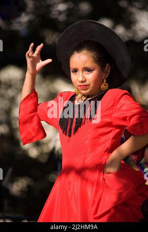 Young girl folkloric dancing at a Cinco de Mayo festival Stock Photo