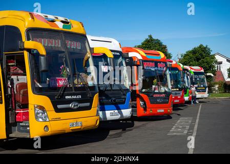 DALAT, VIETNAM - DECEMBER 28, 2015: Multicolored intercity buses at the Dalat Bus Station. Vietnam Stock Photo