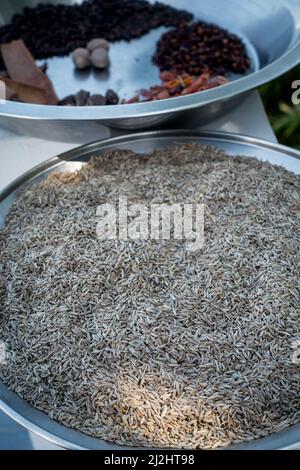 A close up shot of dried cumin in a big metal bowl. Stock Photo