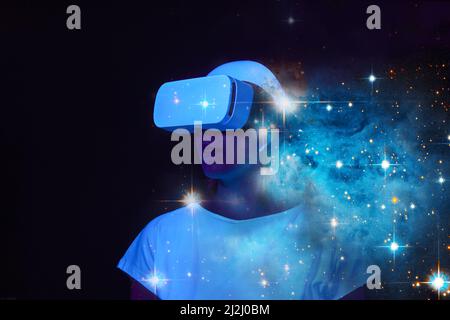 Woman is using virtual reality headset. Elements of this image furnished by NASA. Concept of virtual, augmented and extended reality, future technolog Stock Photo