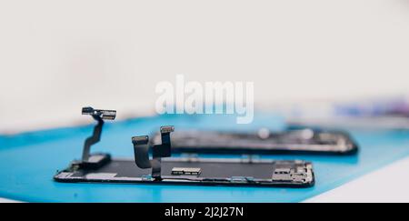 Loops from screen of mobile phone, banner master dismantled for repair. Stock Photo