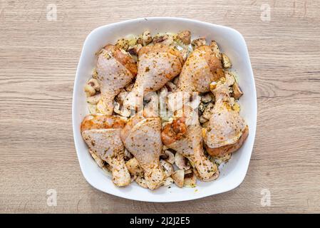 raw chicken drumsticks on baking tray prepared for oven Stock Photo - Alamy