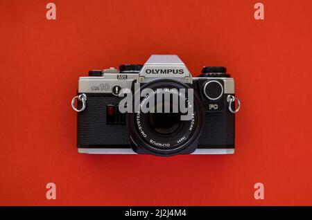 Olympus om10 vintage film camera silver and black body with a 50mm zuiko lens Stock Photo