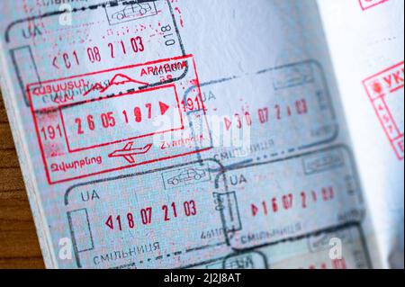 Immigration border stamps from Armenia and Ukraine in the passport. Stock Photo