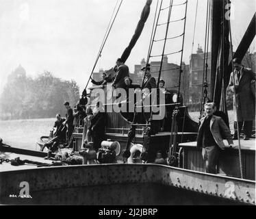 Members of Film Crew on a Barge on the River Thames in London location candid during filming of DAYBREAK 1948 director COMPTON BENNETT story Monckton Hoffe screenplay Muriel and Sydney Box cinematographer Reginald H. Wyer music Benjamin Frankel Sydney Box Productions / General Film Distributors (GFD) Stock Photo