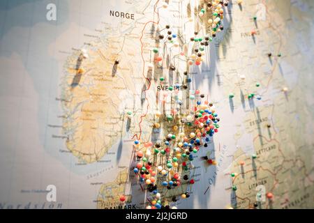 High angle view of straight pins on Scandinavia map Stock Photo